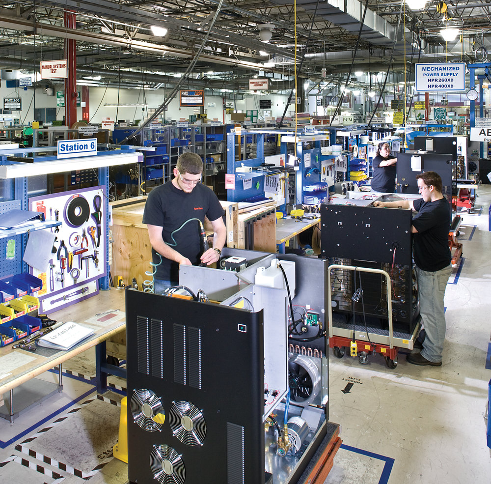 Plasma power sources being assembled on a factory production line