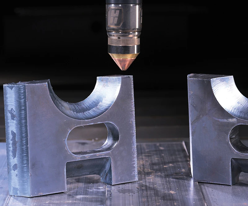 Hypertherm XPR torch above thick plasma cut steel parts